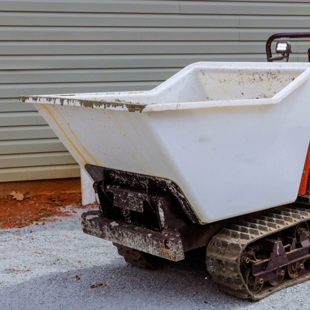 A mini dumper being used to transport materials around a DIY worksite.